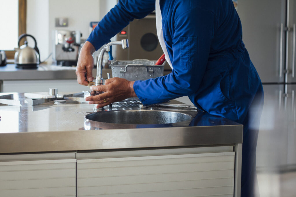 decatur plumber working on a sink