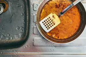 greasy pan and kitchen sink drain