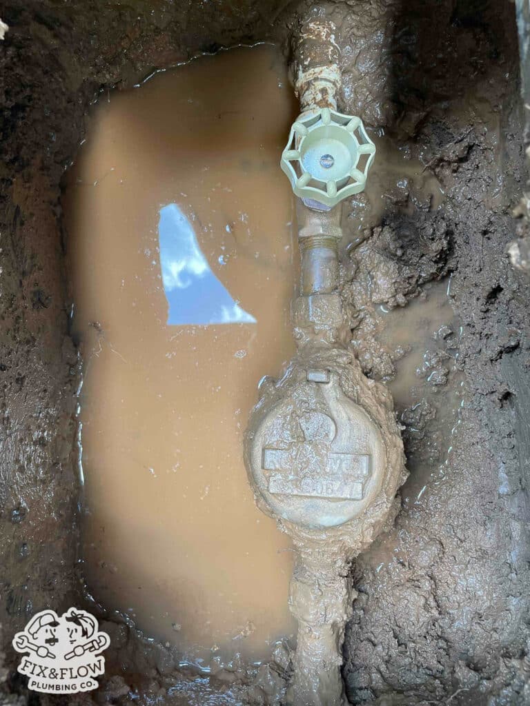 Water Main Leaking and Being Repaired
