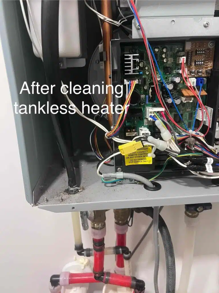 Fix & Flow Atlanta plumber inspects tankless water heater internal components after professional cleaning